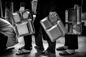 The girls wait for long hours in the queue for food. © Sadegh Souri